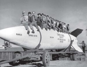GE employees: General Electric employees posing on a V-2 rocket at White Sands Proving Ground (now White Sands Missile Range) in New Mexico. (Courtesy of White Sands Missile Range)